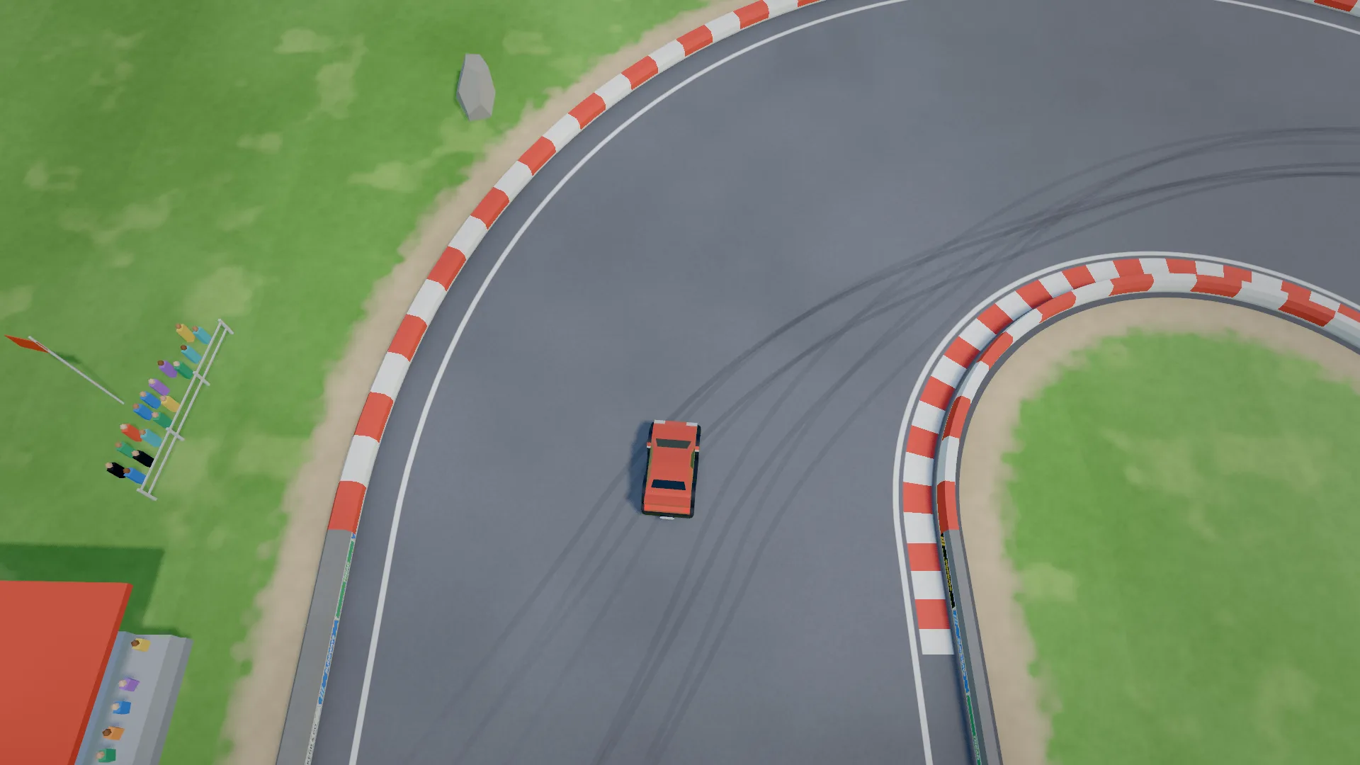 A red car sliding through a green-field bend lined with red and white kerbs, a grandstand crowd beside the track